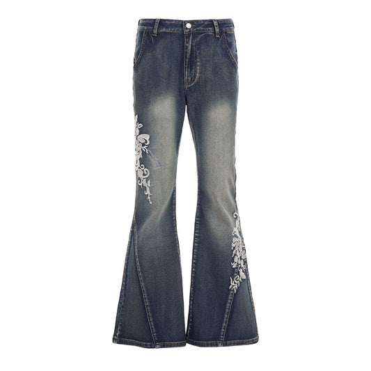 Jeans svasati vita bassa con ricamo floreale